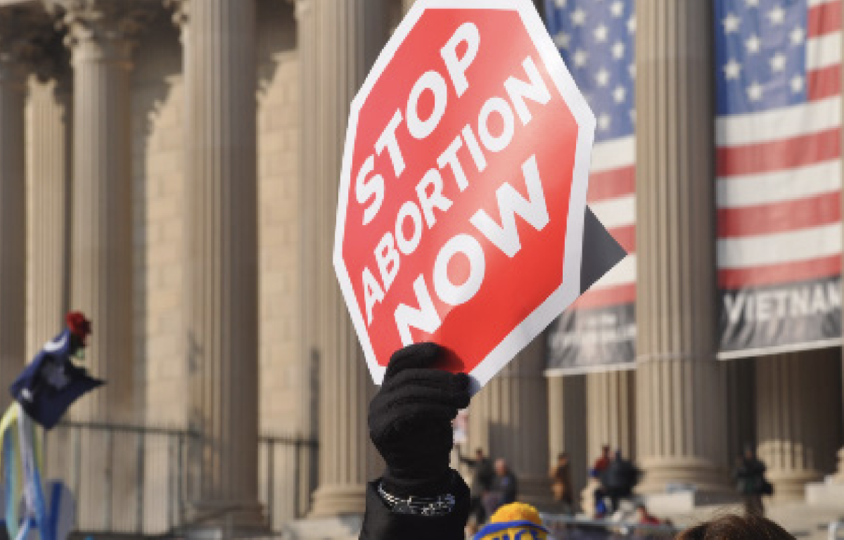 PROTEST: Anti-abortionists advocates hold signs outside of the Capitol Building. 